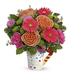Teleflora’s Time To Celebrate Bouquet. An arrangement by Marivel's Florist and Gifts.
