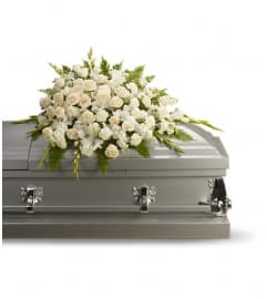 Silken Serenity Casket Spray. An arrangement by Wasaga Flowers.