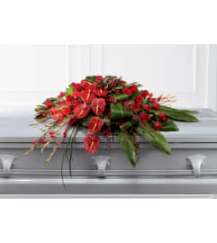 The FTD® Peaceful Passage™ Casket Spray. An arrangement by Mystic Garden Floral.