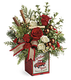 Teleflora's Quaint Christmas Bouquet. An arrangement by Pompano Beach Floral.