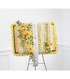 The FTD® Taken Too Soon™ Bible Easel. An arrangement by Mystic Garden Floral.