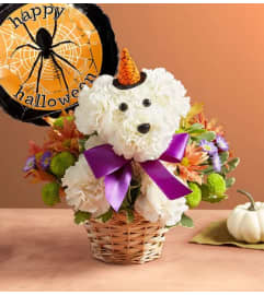 Witchy Pooch™ with Balloon. An arrangement by Flowers of Jacksonville.