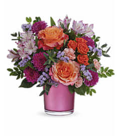 The Teleflora's Sunset Serenade Bouquet. An arrangement by Marivel's Florist and Gifts.