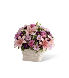The FTD® Loving Sympathy™ Basket. An arrangement by Mystic Garden Floral.