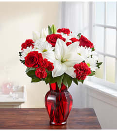 Red and White Delight™. An arrangement by Garden of Eden Floral.