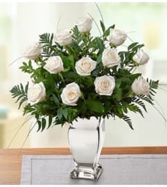 Premium White Roses in Silver Vase. An arrangement by Blessing and Blooms Florist.