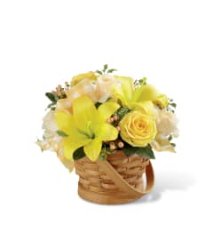 The FTD® Sunny Surprise™ Basket. An arrangement by Mystic Garden Floral.