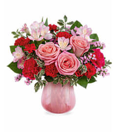 The Teleflora's Sweet On Hue Bouquet. An arrangement by Marivel's Florist and Gifts.