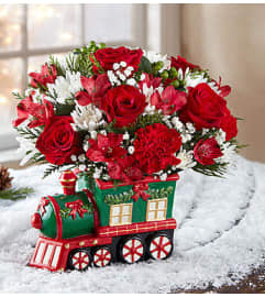 Christmas Express Train™. An arrangement by Graceland Florist.