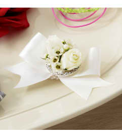The FTD® Pure Heaven™ Wristlet. An arrangement by Sandy's Florist.