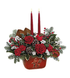 A Teleflora's Christmas Classic Centerpiece. An arrangement by Margaret's Florist.