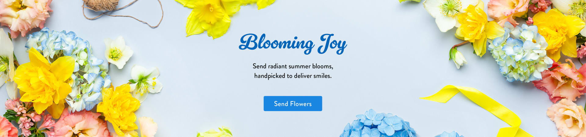 A variety of summer flowers, yellow and white, on a blue background - flower delivery in Houston