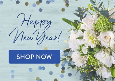 New Year's celebration with white flowers and confetti - flower delivery in Davie