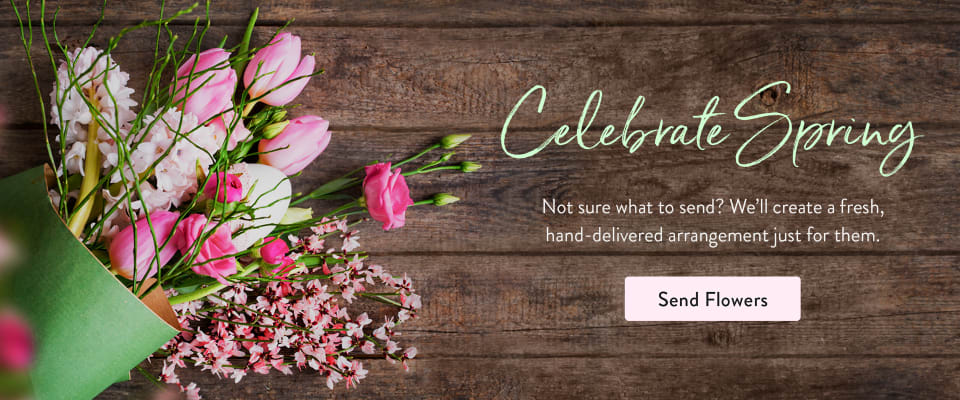 Springtime flower bouquet with pink tulips on a rustic wood background - flower delivery in Midtown Phoenix