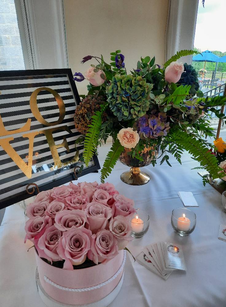 Ceremony floral décor with arches and aisle arrangements