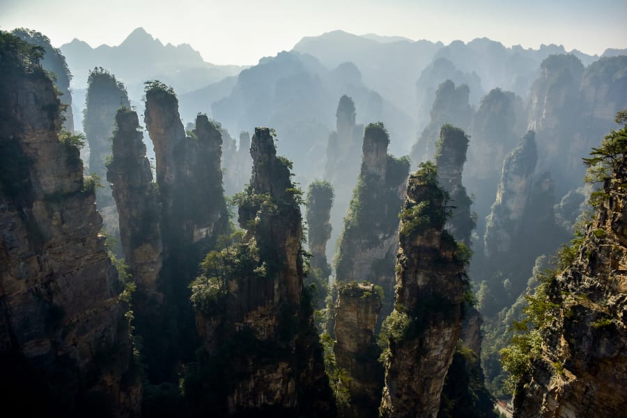 Discover Zhangjiajie's spectacular sandstone pillars, famous for their Avatar-like scenery.