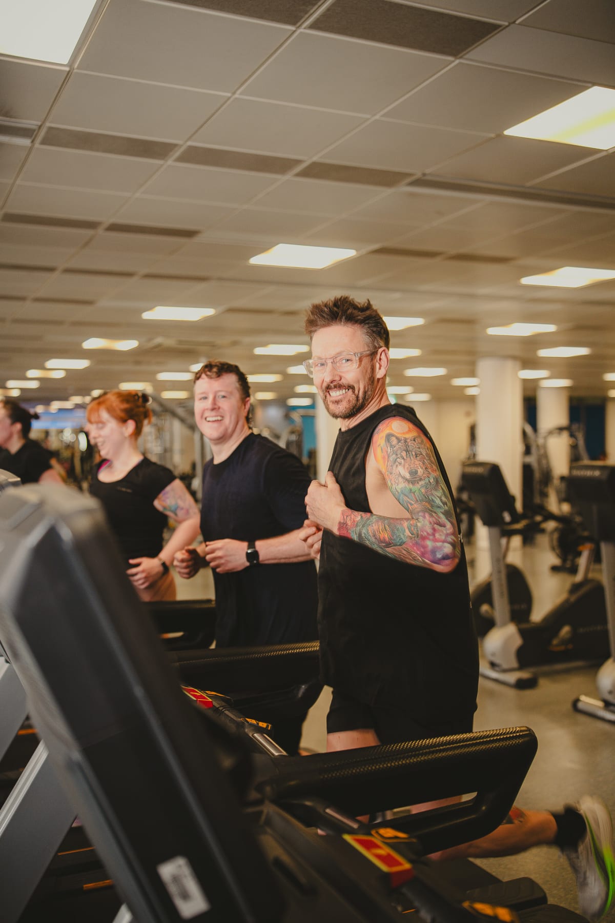 Ayren Honey running on treadmills side by side with his clients