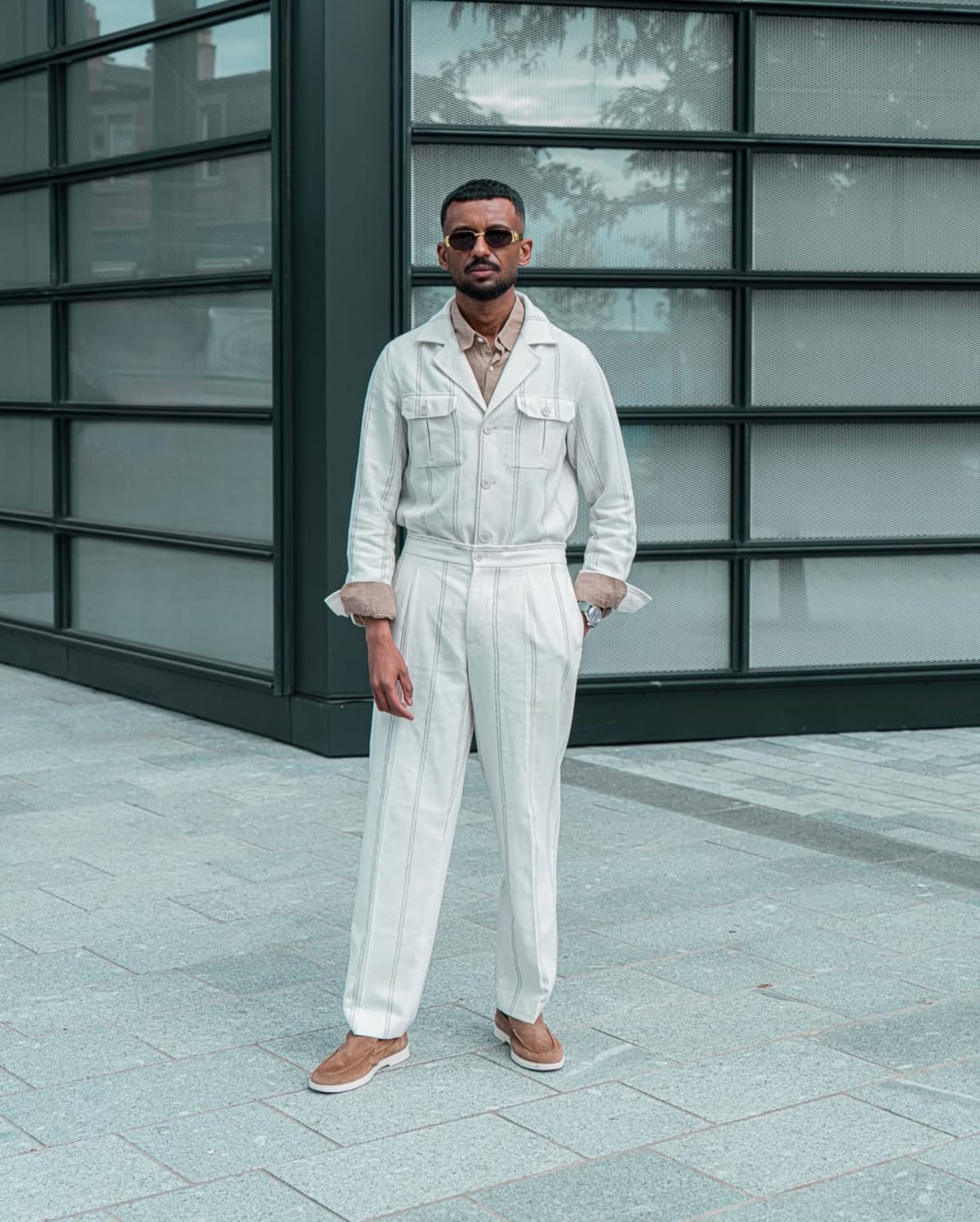 Full length shot of Ehab Ali in a white outfit in Edinburgh's New Town