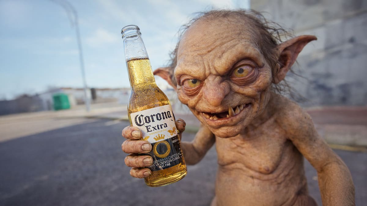CGI goblin holding a bottle of Corona beer in the Los Duendes music video