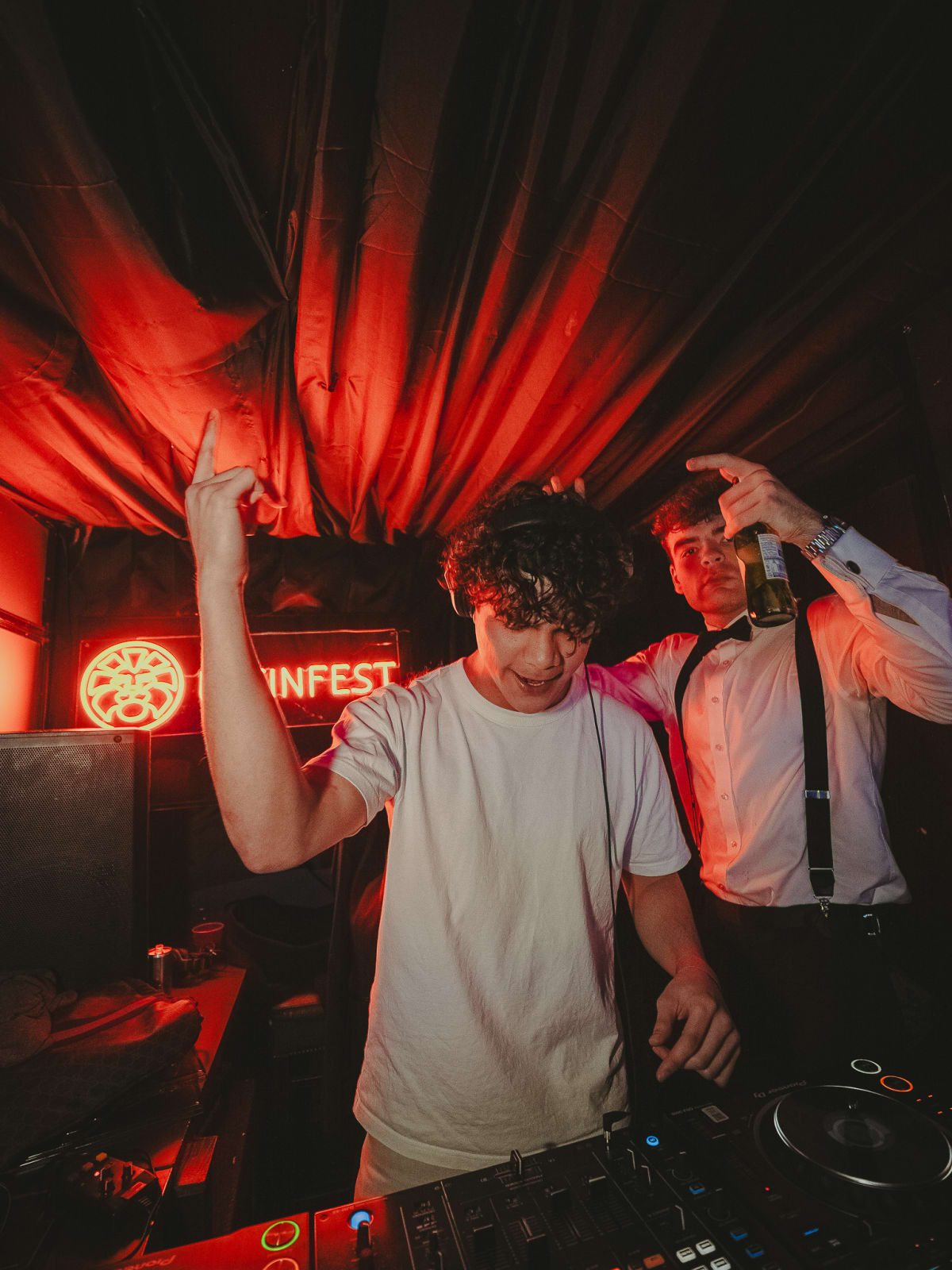 DJ performing at the decks at Latin Fest