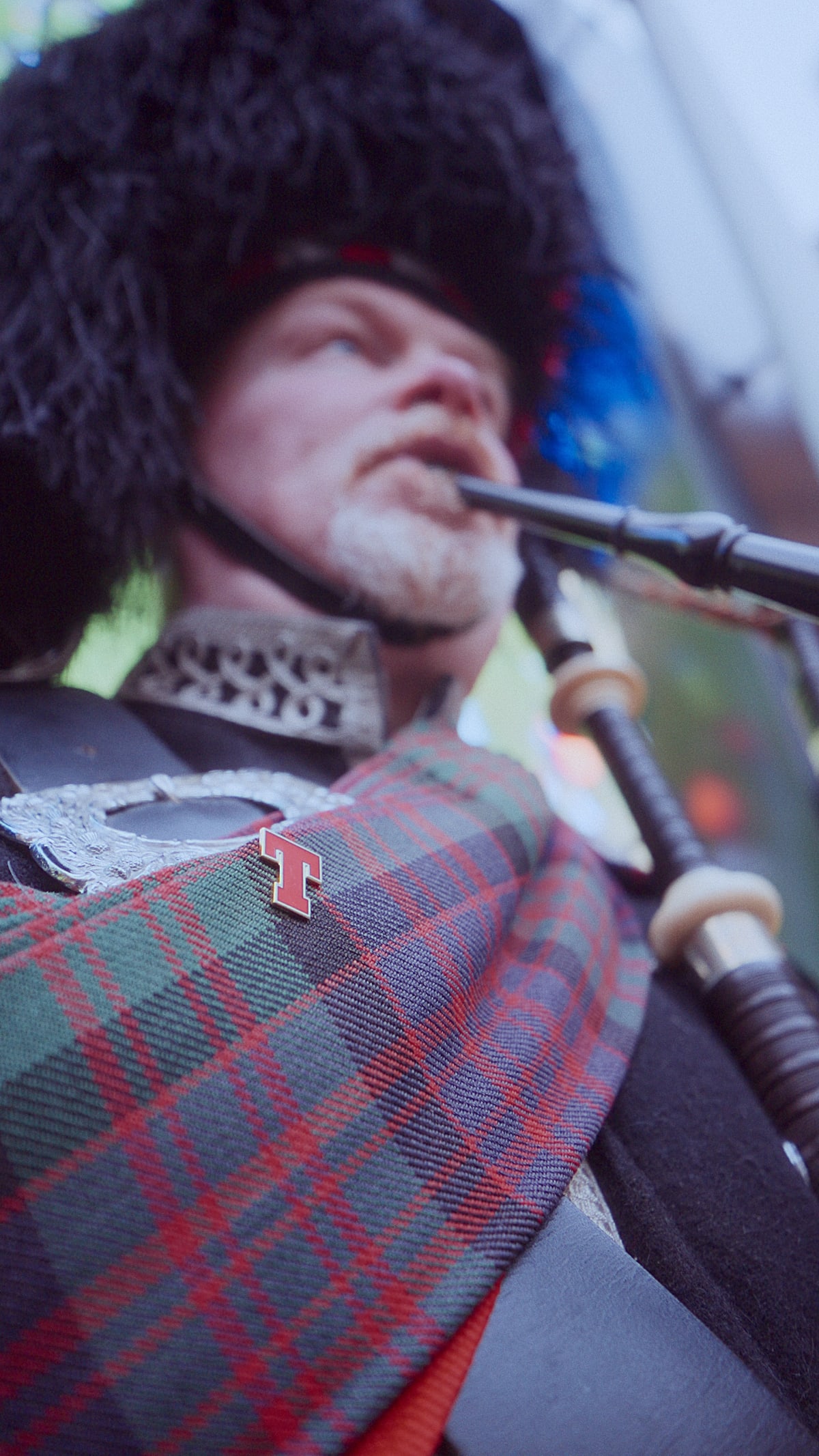 Piper wearing a Tennent's tartan sash at The Second Stadium fan event