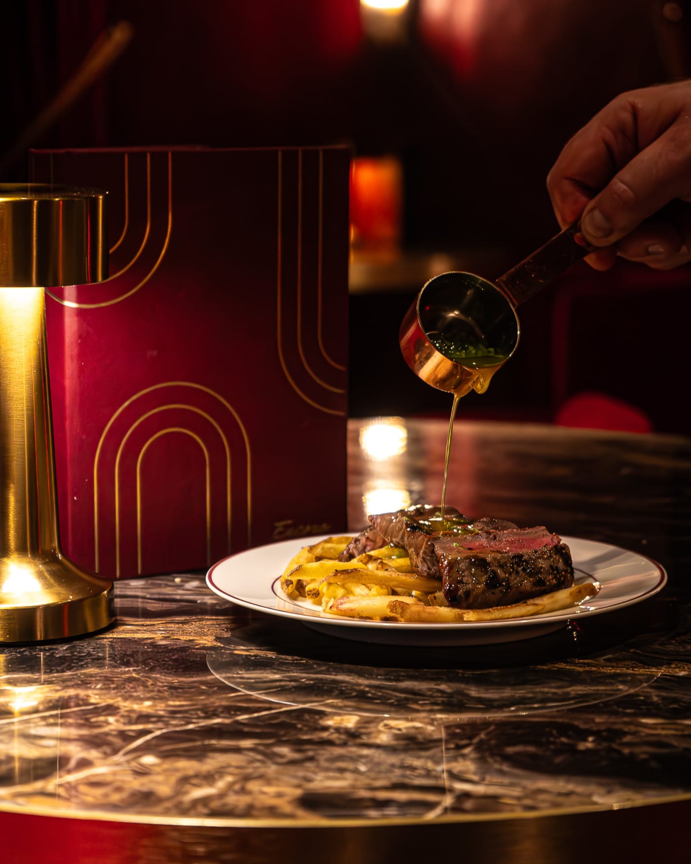 Steak with sauce poured tableside at Encore, Edinburgh