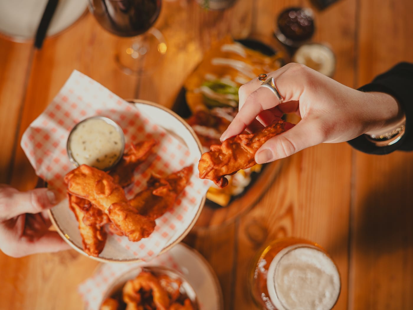 Sharing wings and beer from above at Newsroom Edinburgh