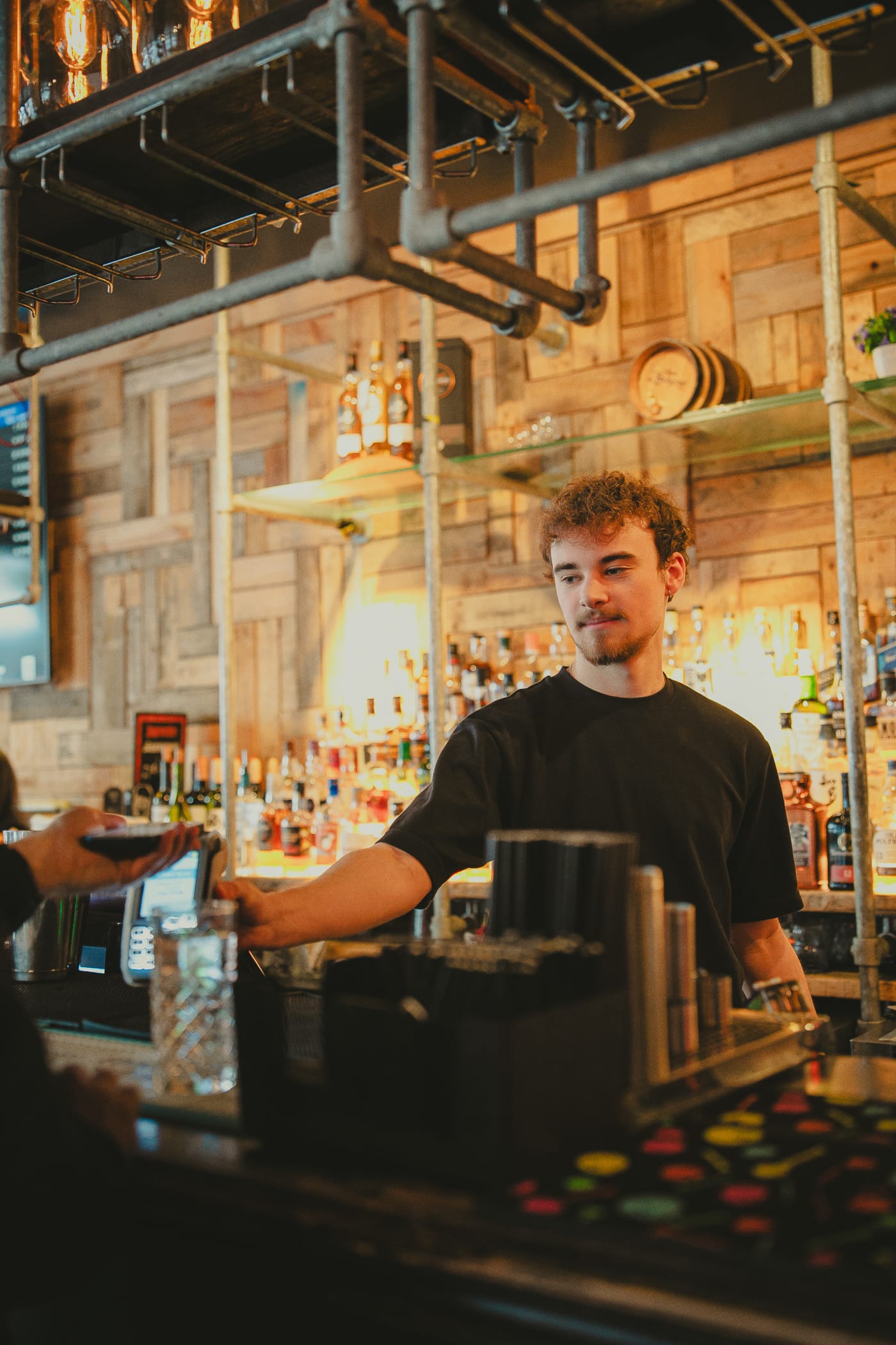Bartender pouring a cocktail at Newsroom Edinburgh