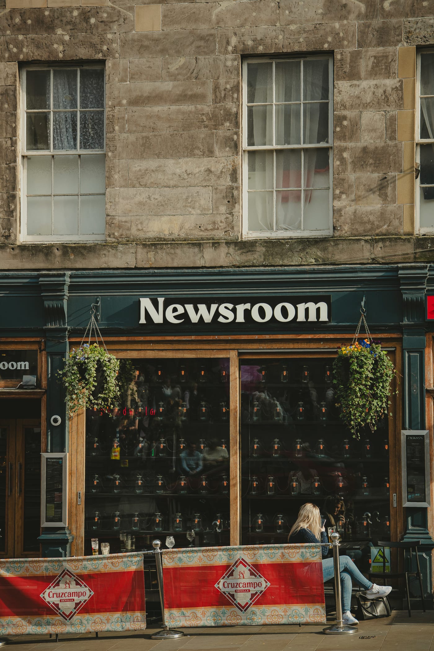 Newsroom facade with hanging plants on Leith Street