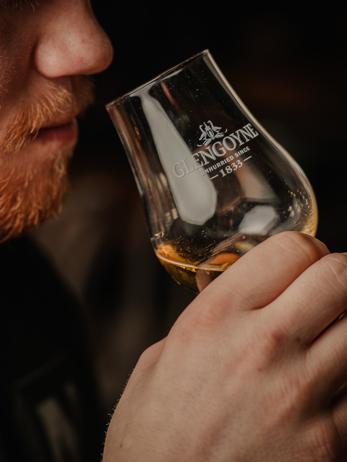 Nosing a dram from the whisky flight at Newsroom Edinburgh