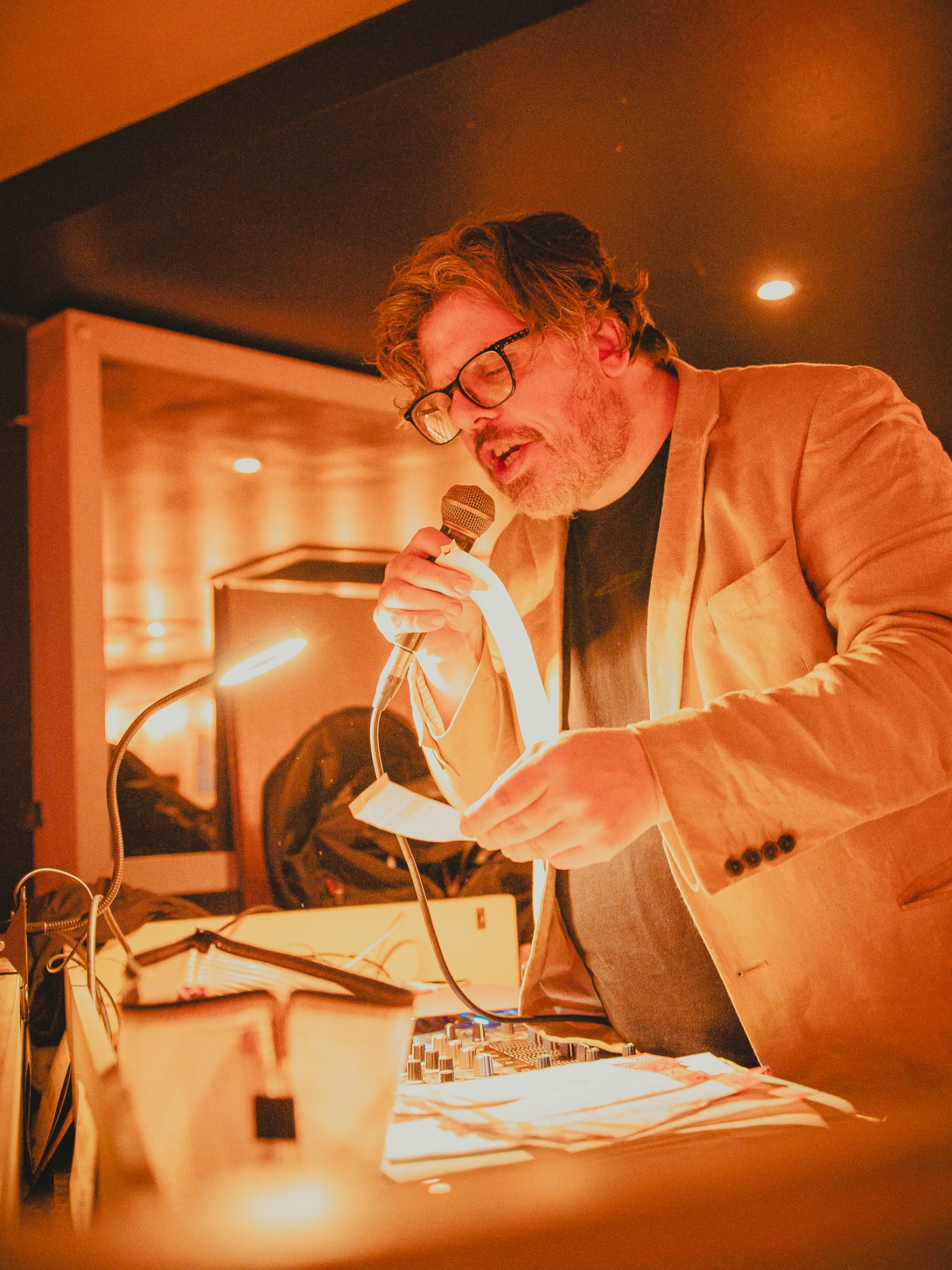 Quiz night host on the mic at Newsroom