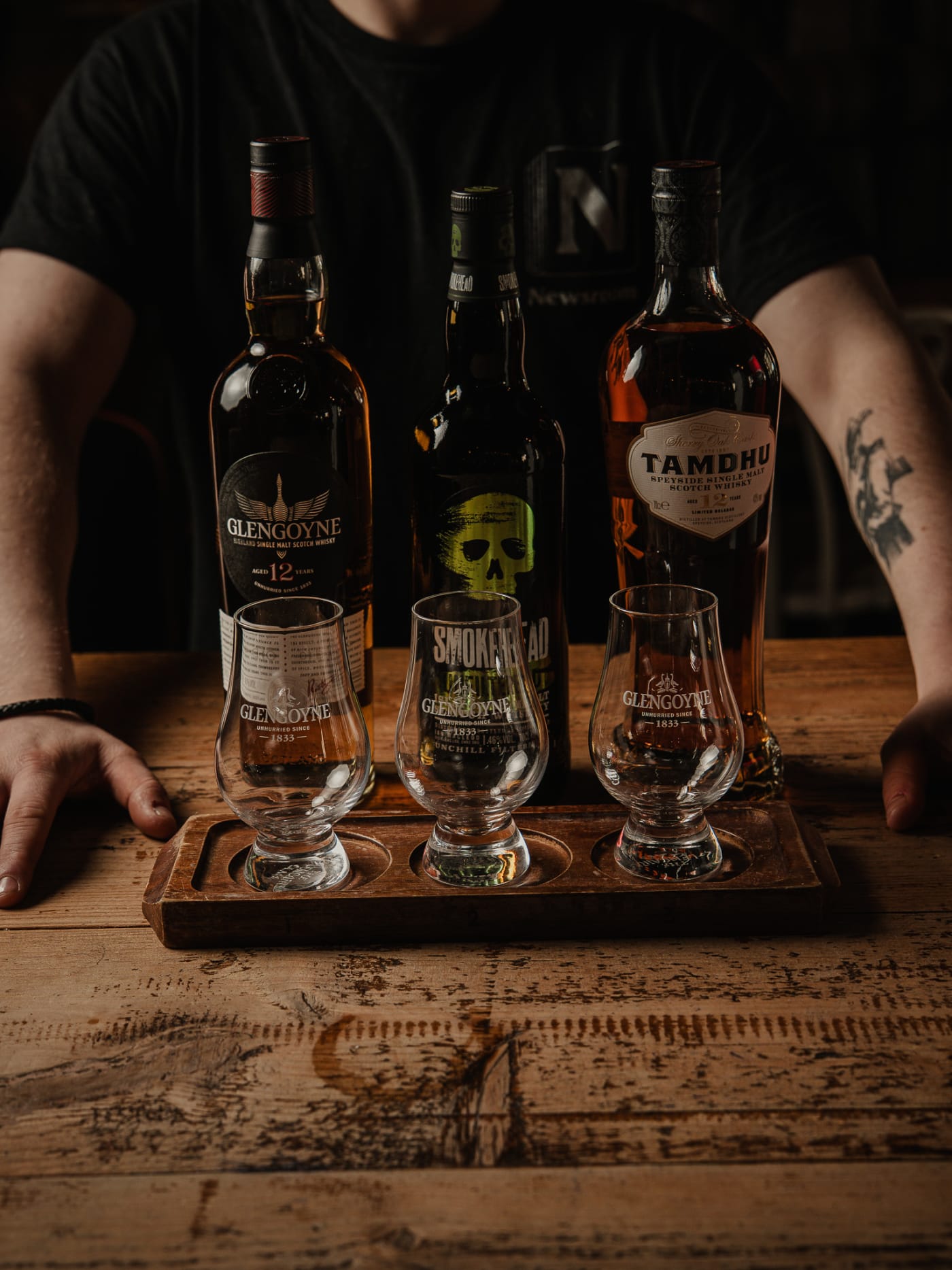 Whisky tasting flight of three drams in Glencairn glasses with Glengoyne, Smokehead and Tamdhu bottles at Newsroom, Edinburgh