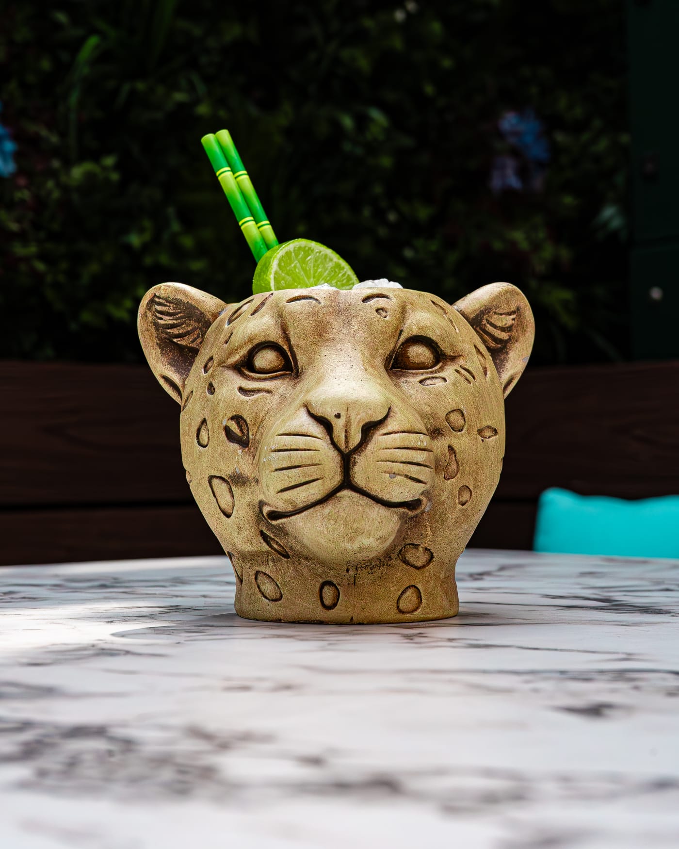 Leopard tiki mug with lime and bamboo straw at Rose Street Garden, Edinburgh