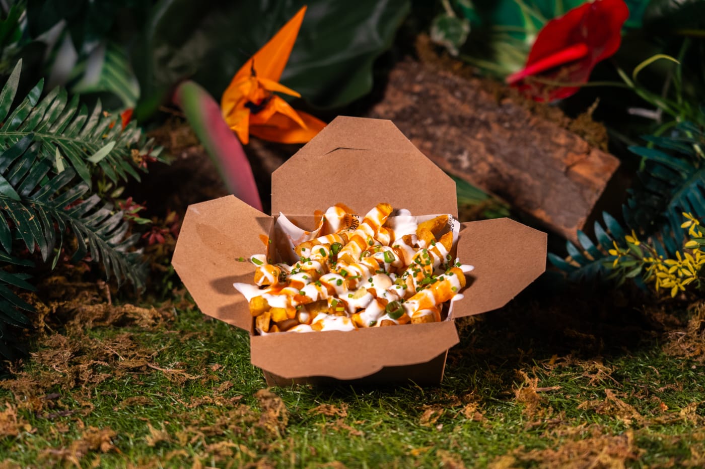 Poutine-style loaded fries in a takeaway box at Rose Street Garden, Edinburgh