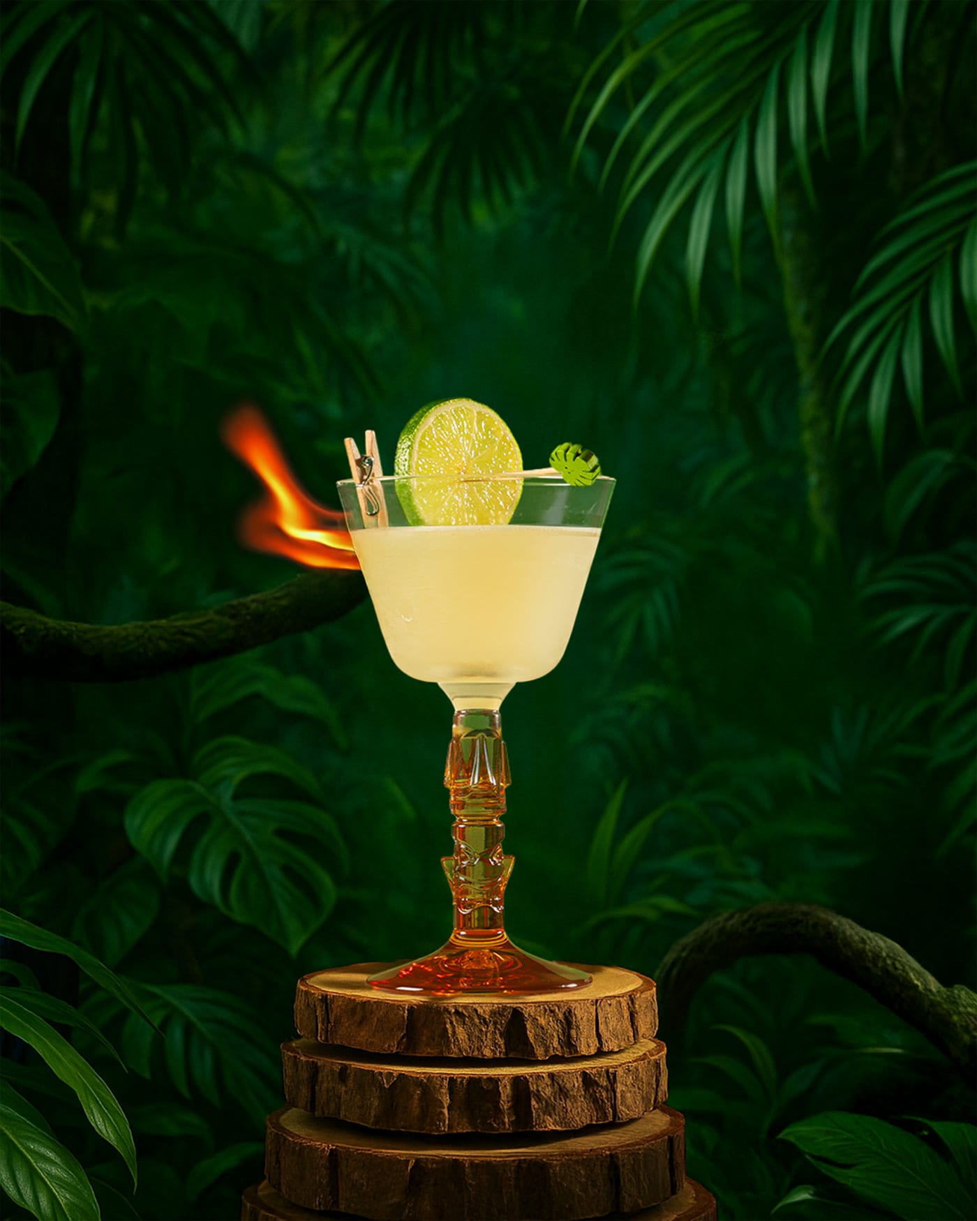 Flaming garnish on a daiquiri against the jungle backdrop at Rose Street Garden, Edinburgh