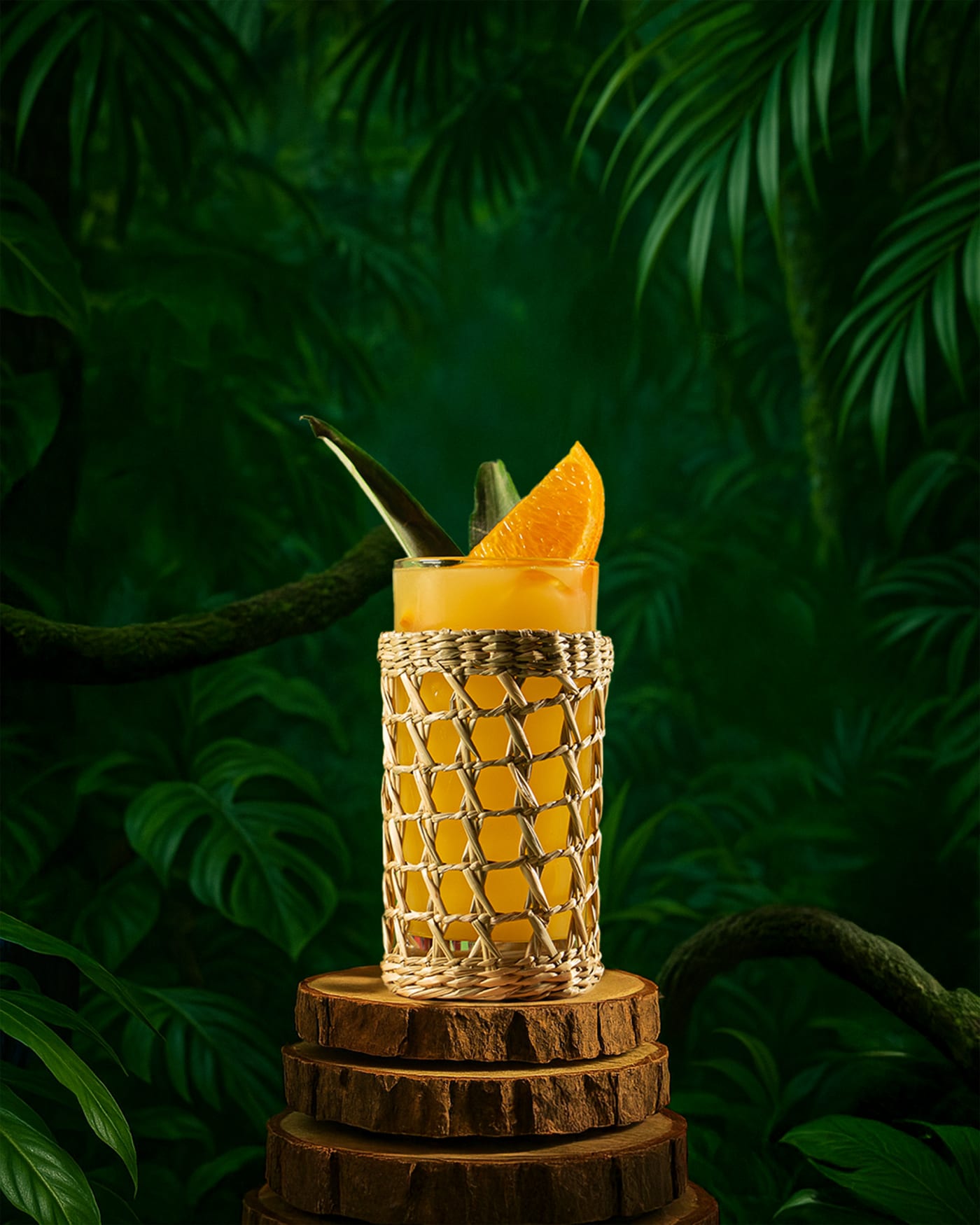 Rum cocktail in a woven-wrapped glass at Rose Street Garden, Edinburgh