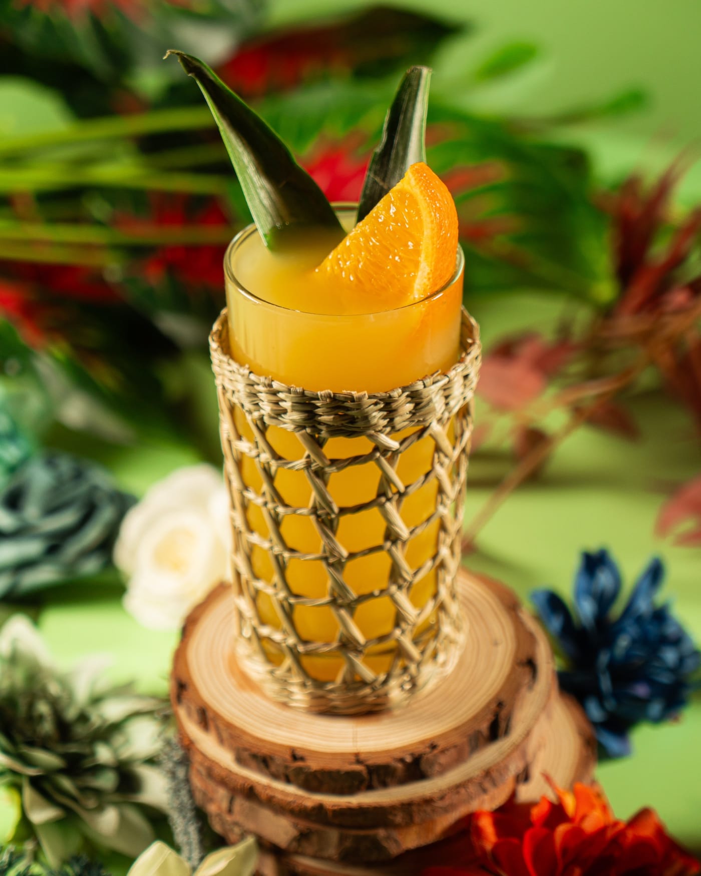 Orange tiki serve with pineapple leaves at Rose Street Garden, Edinburgh