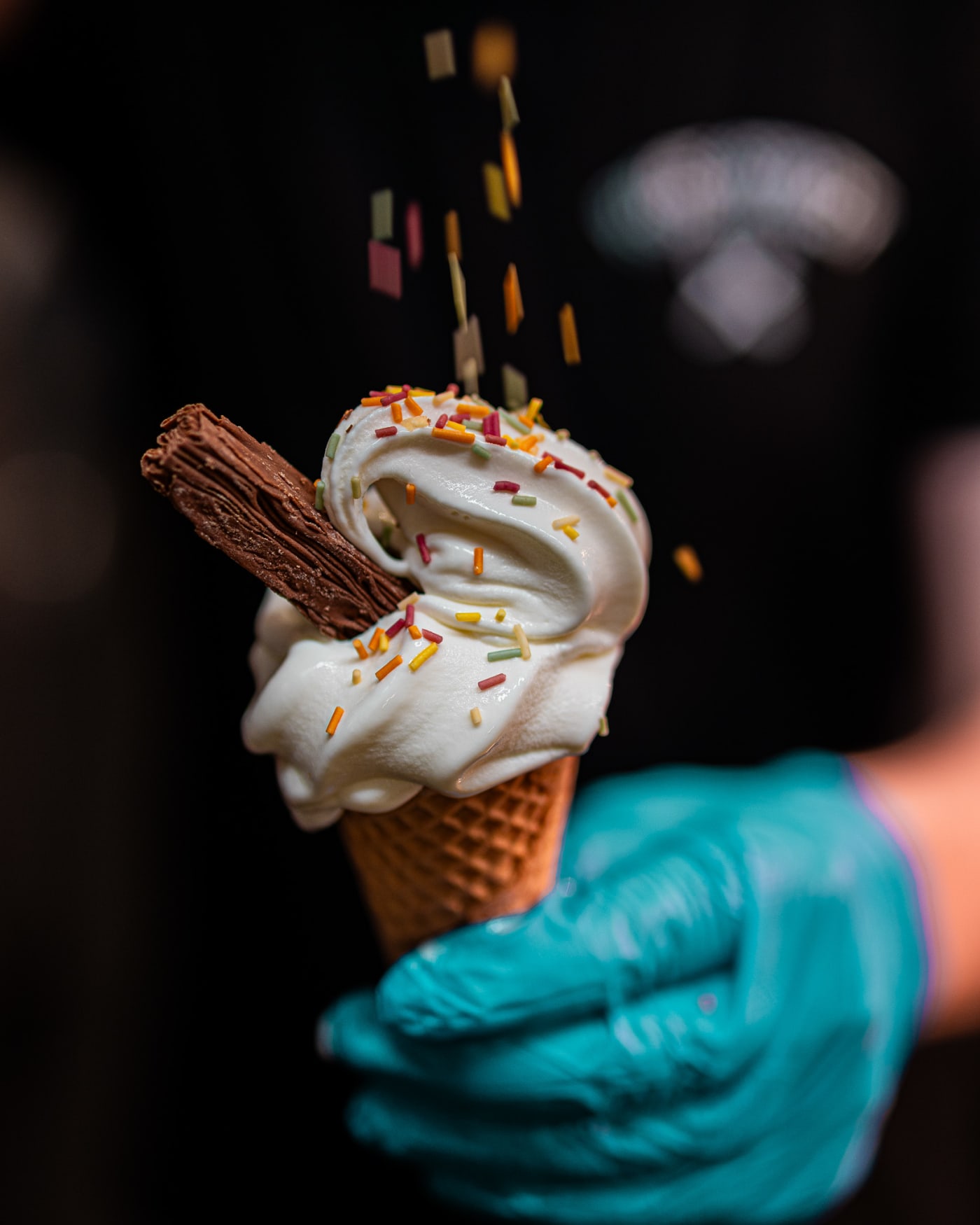 Soft serve cone with sprinkles falling at Rose Street Garden, Edinburgh