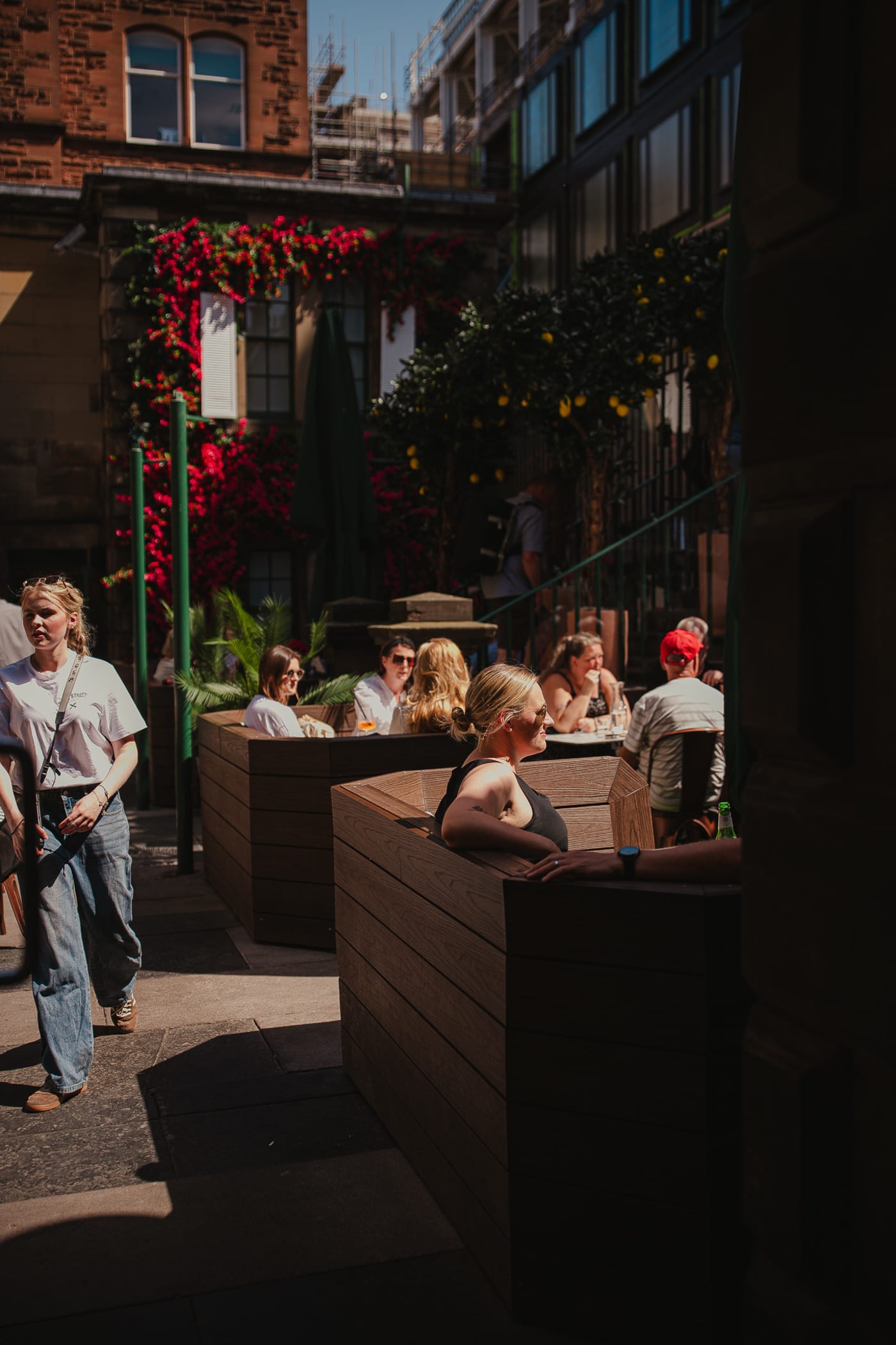 Busy summer afternoon on the terrace at Rose Street Garden, Edinburgh