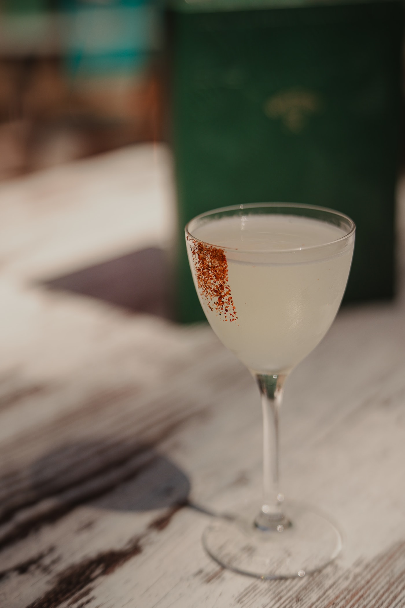 Chilli-rimmed margarita on a rustic table at Rose Street Garden, Edinburgh