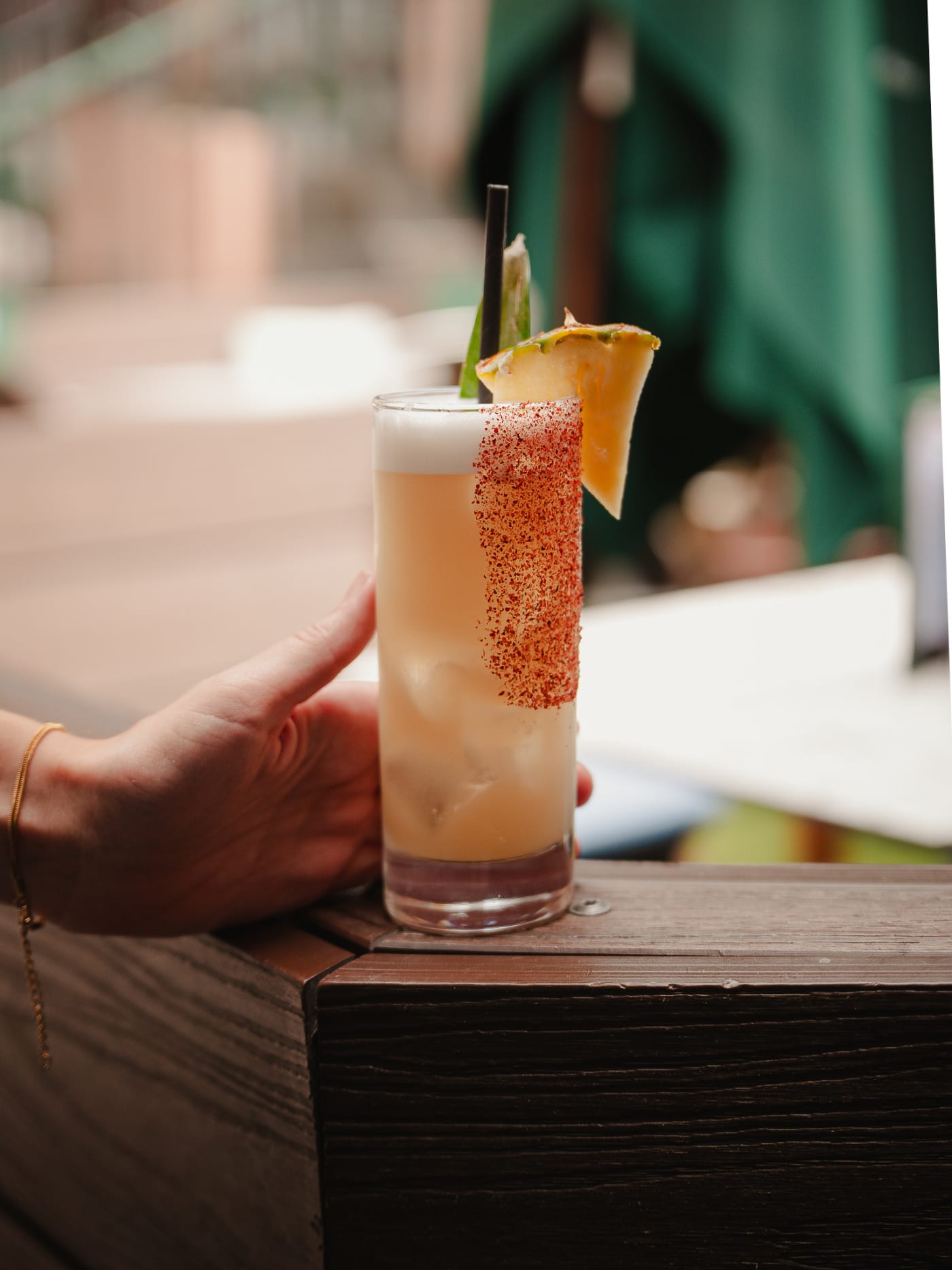 Chilli-salt spritz held on the terrace rail at Rose Street Garden, Edinburgh