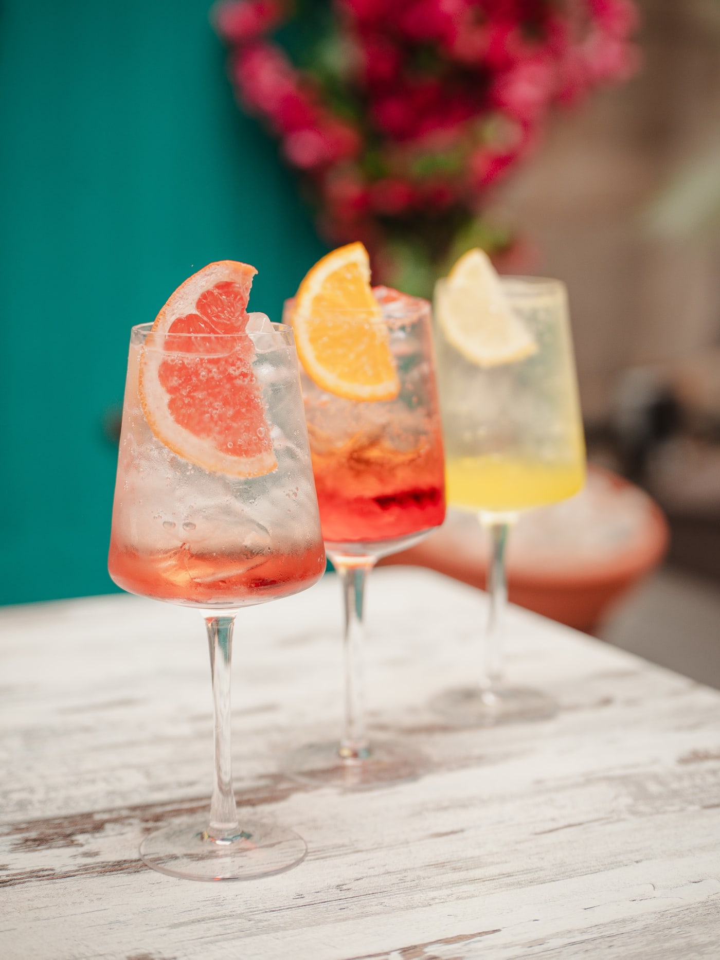 Trio of spritzes by the turquoise door at Rose Street Garden, Edinburgh