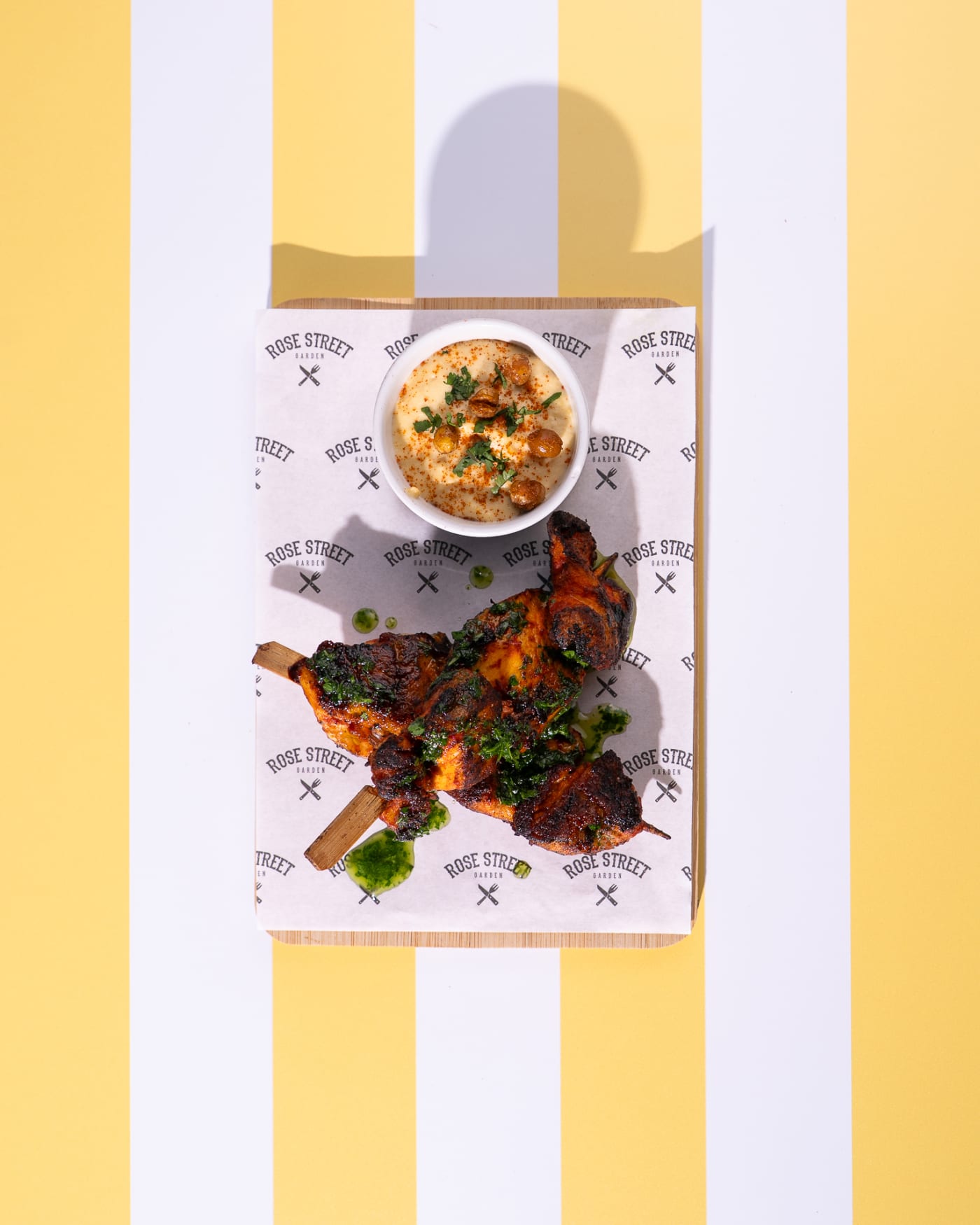 Glazed chicken skewers with dip from above at Rose Street Garden, Edinburgh