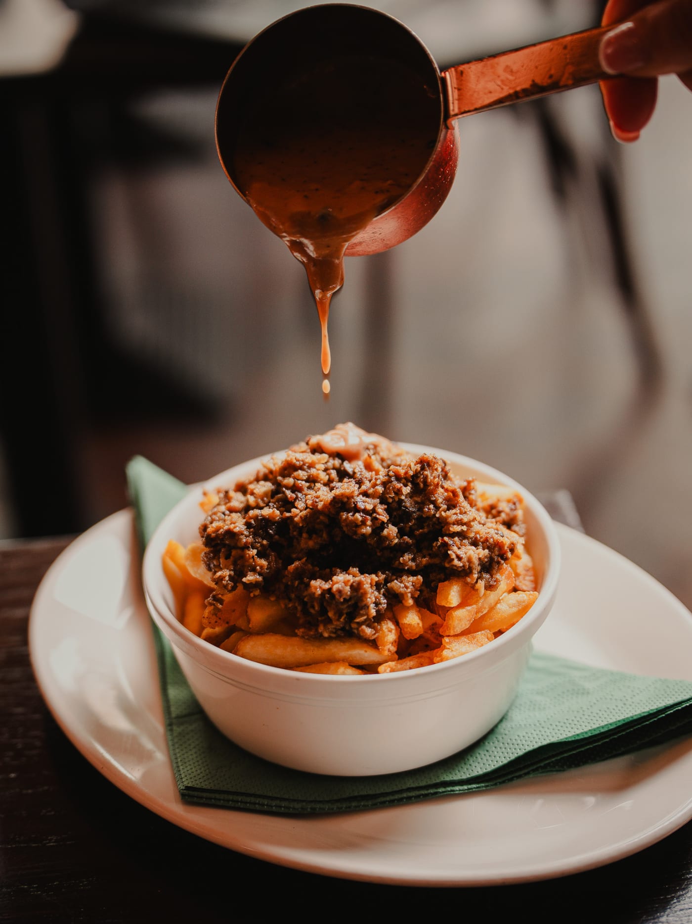 Gravy poured over loaded fries at Ryan’s of Edinburgh