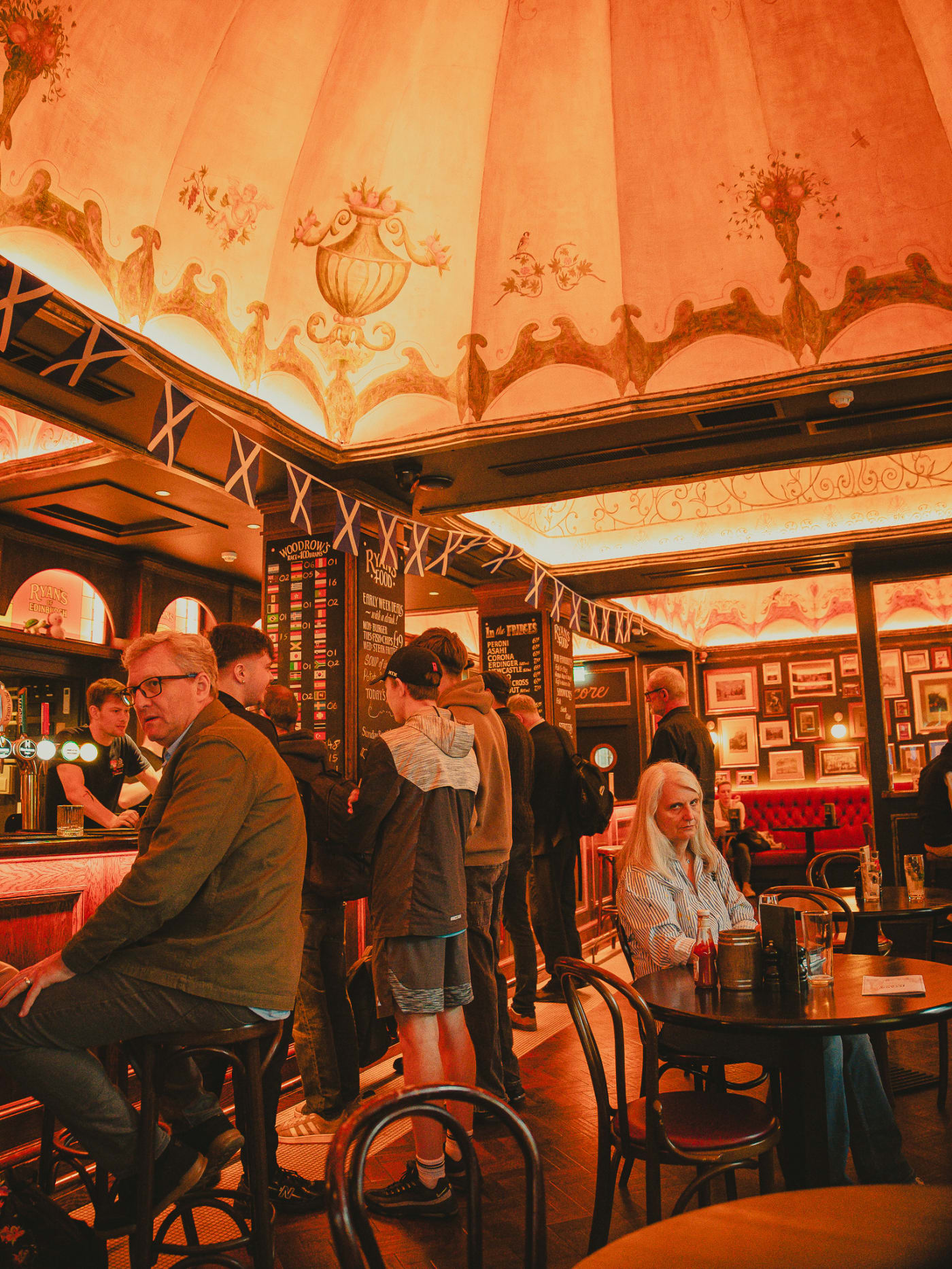 Hand-painted ceiling and Saltire bunting inside Ryan's of Edinburgh
