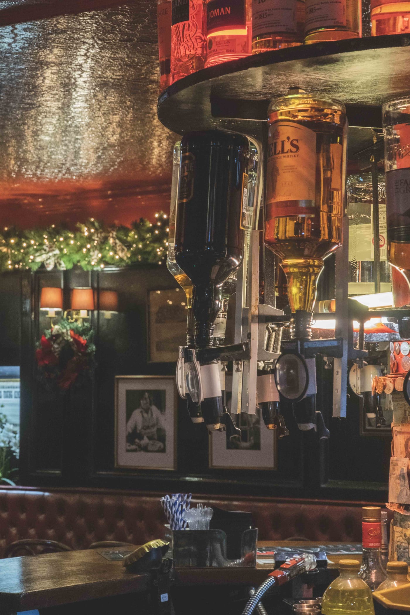 Back bar with spirits and taps at The Bailie Bar