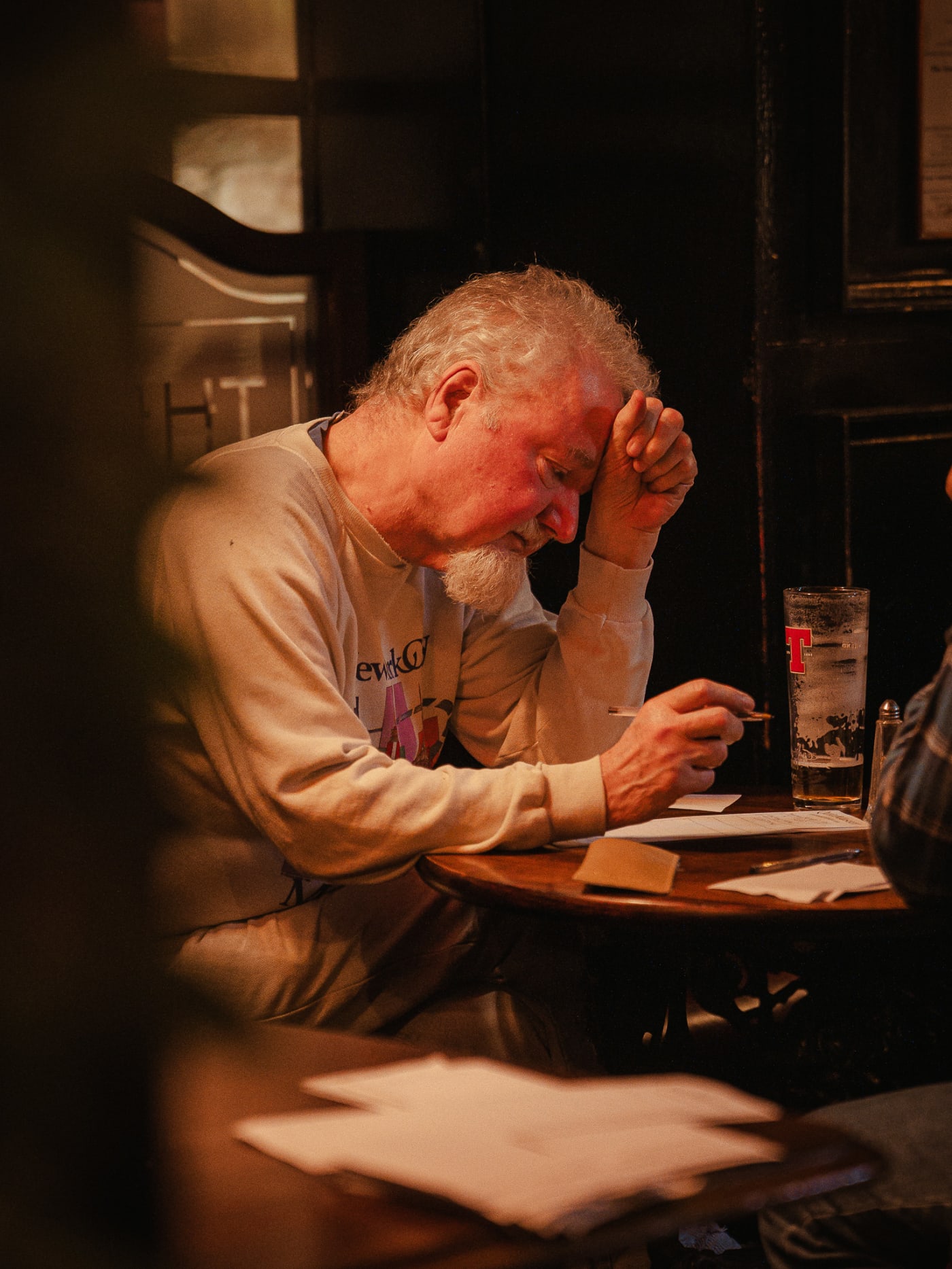 Guest reading the menu at The Bailie Bar, Stockbridge
