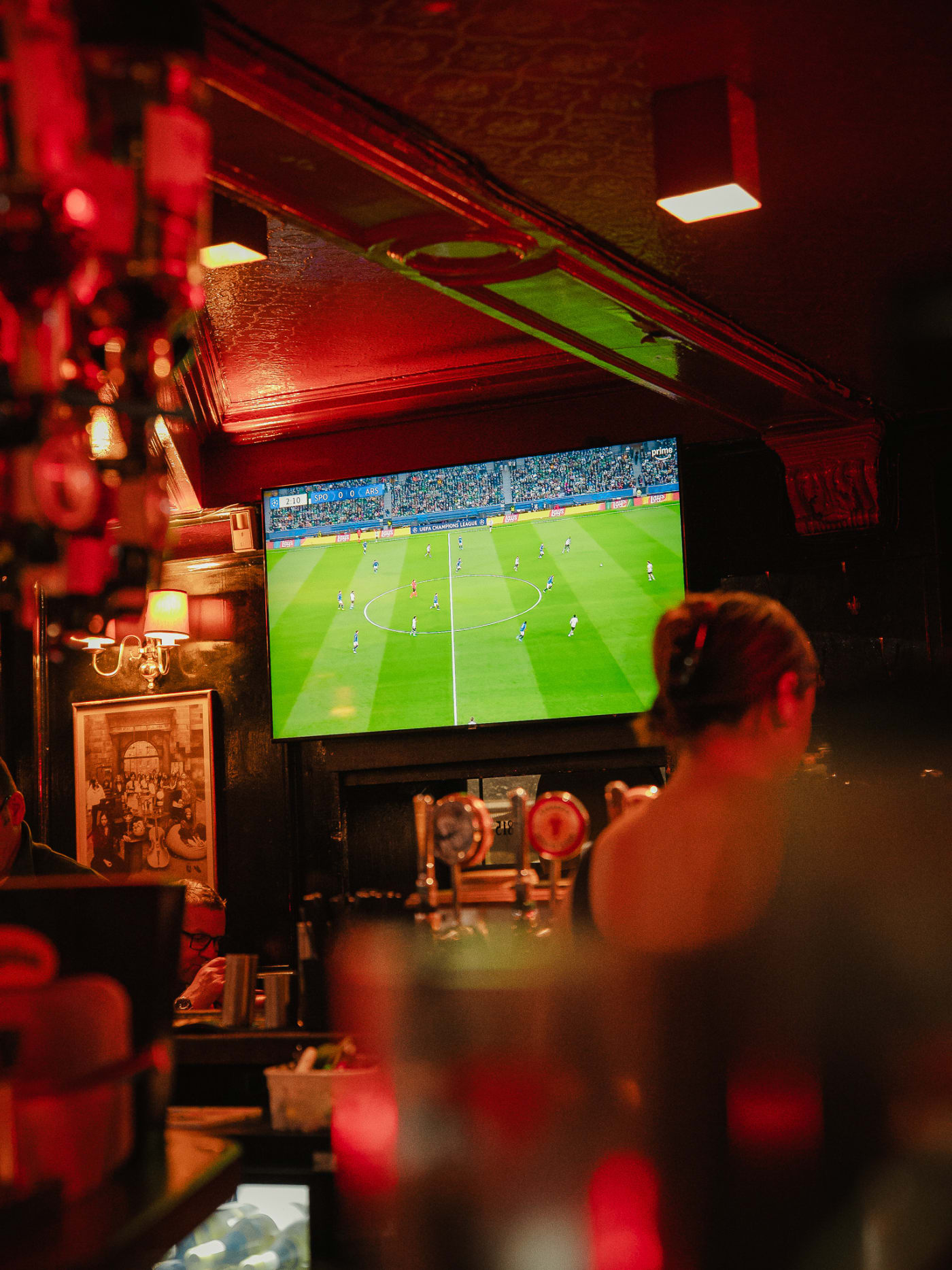 Guests watching football at The Bailie Bar
