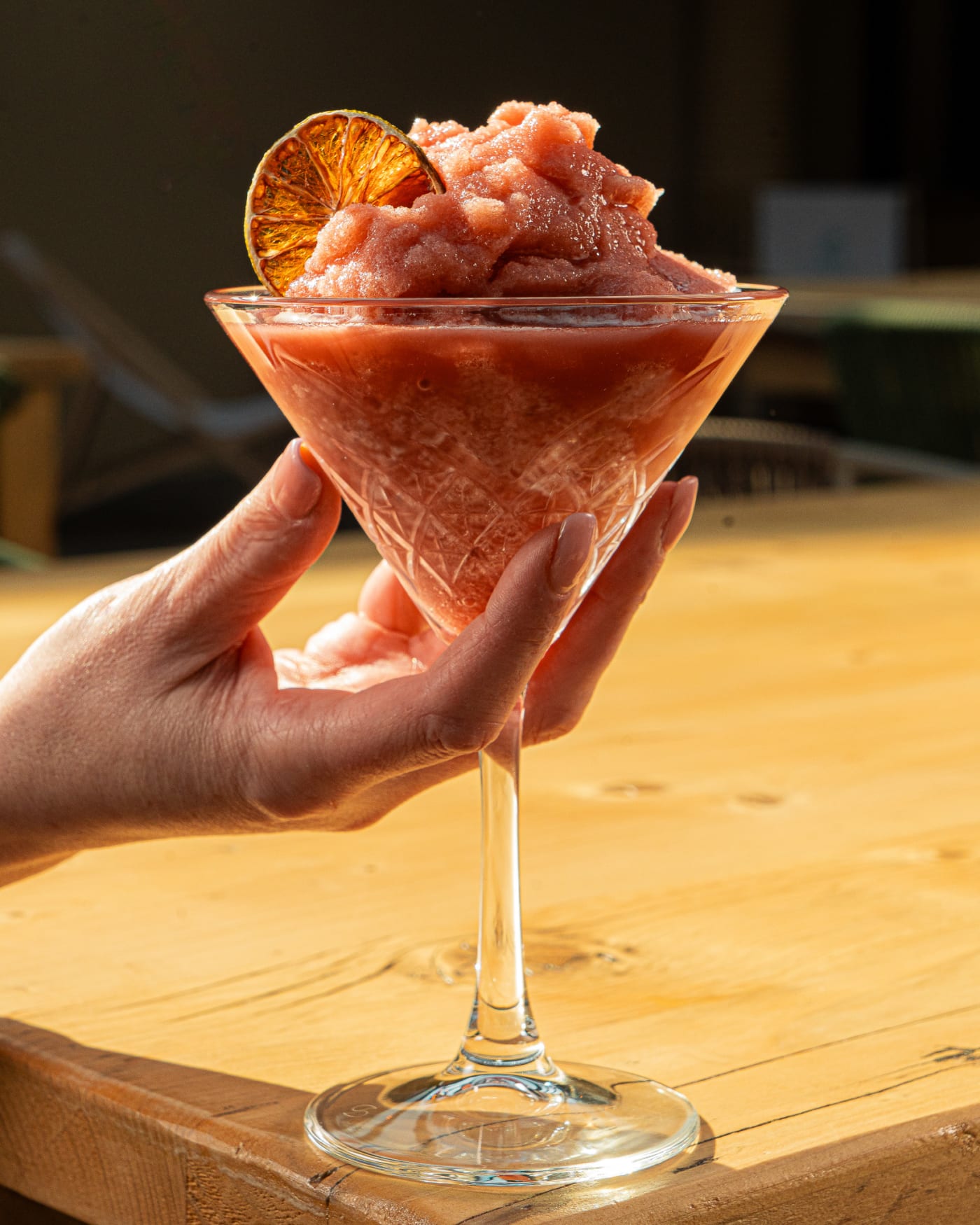 Hand holding a frozen watermelon cocktail at The Ship Inn, Musselburgh