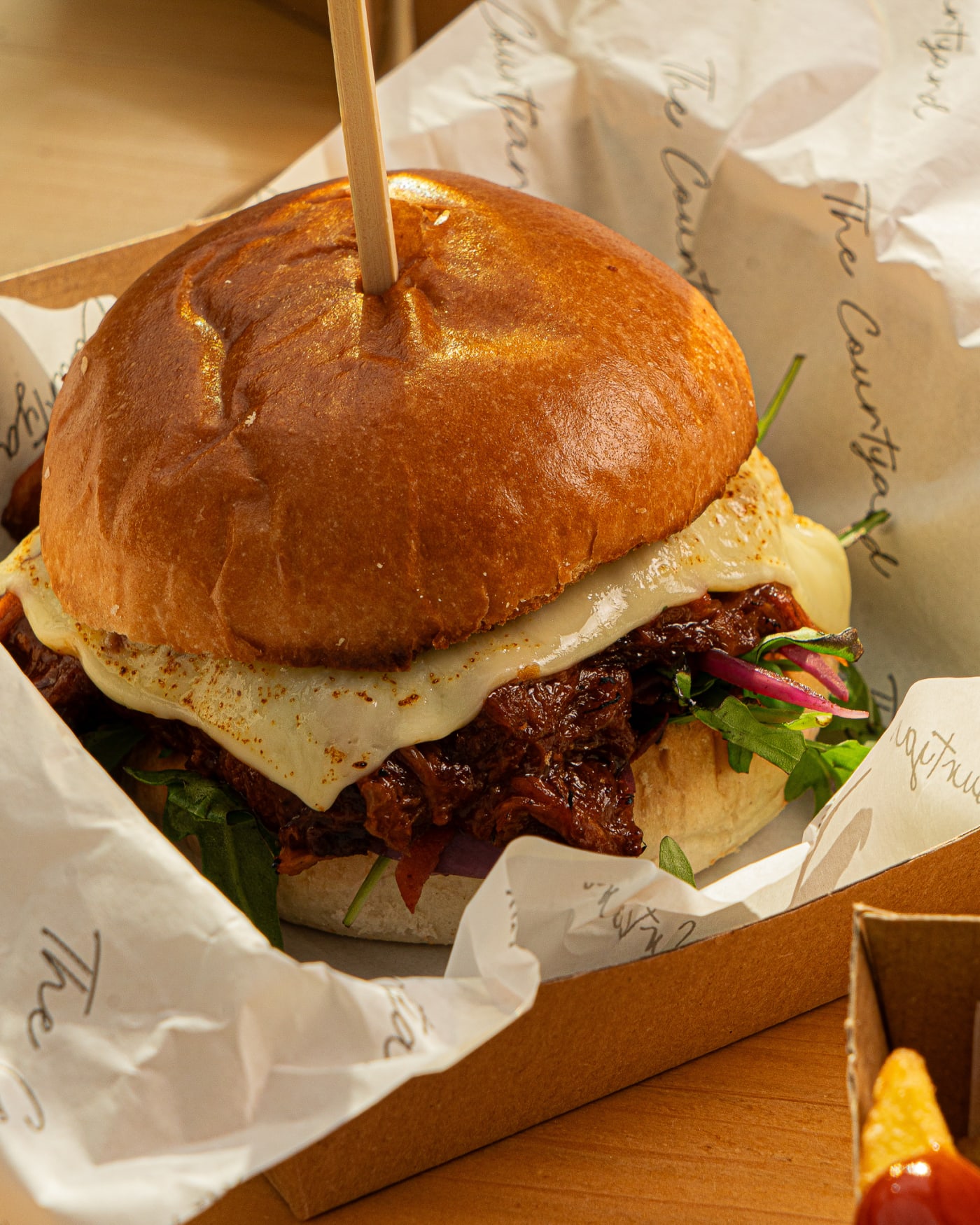 Bacon burger with a skewer at The Ship Inn, Musselburgh